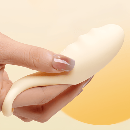 Actual photo of the vibrator worn on the finger: The product fits perfectly on the finger, showcasing its integrated, natural control design, addressing the hygiene concerns of long nails.